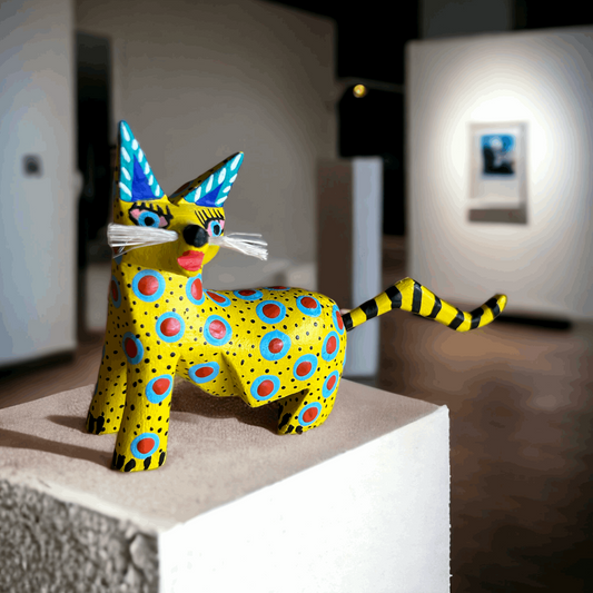 Stunning Alebrije from Oaxaca Mexico, a handcarved copal wood treasure showcasing a yellow cat with blue and red spots