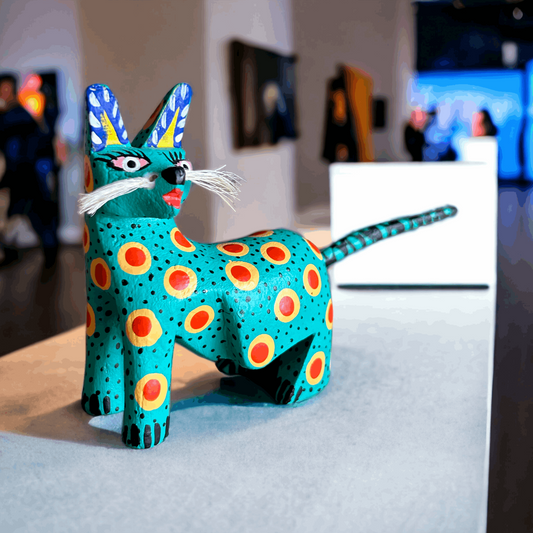 A vibrant feline alebrije in an exquisite hand carved technique , exuding an aura of elegance and charm